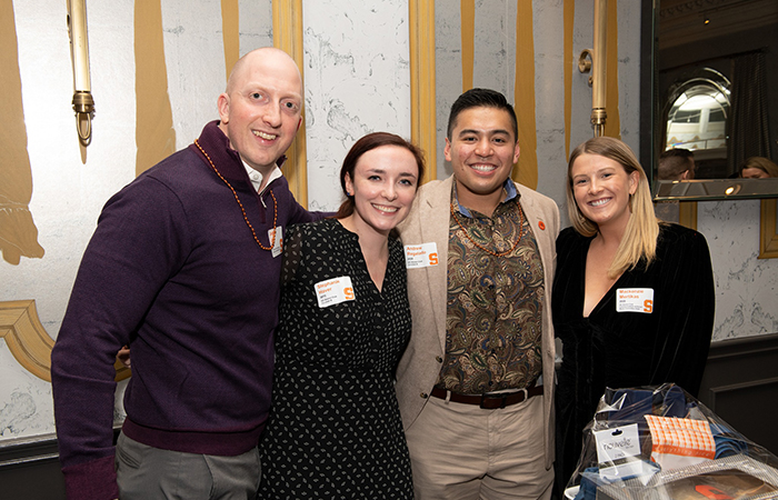 DC Alumni Club Leaders at the auction table.